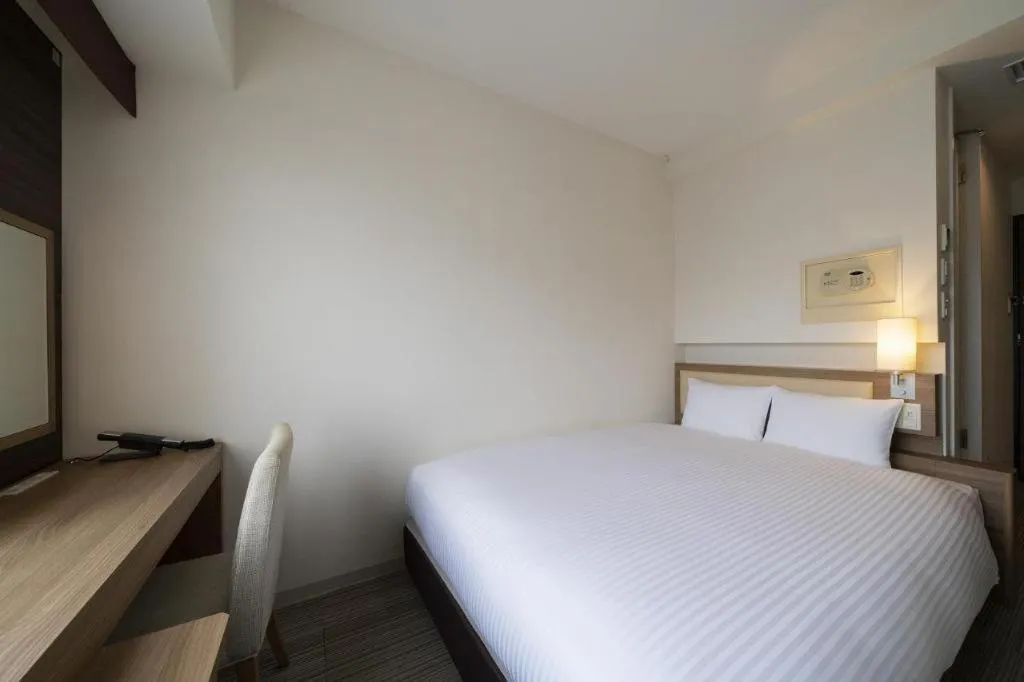 Bed in Hotel Oriental Express Nagoya Sakae