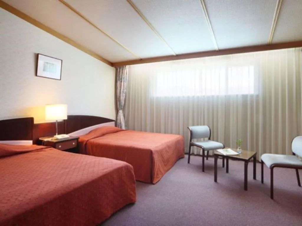 Bed in Oze Iwakura Resort Hotel