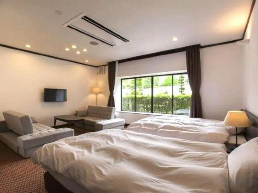 Bed in Hotel Silk Onsen Yamabiko