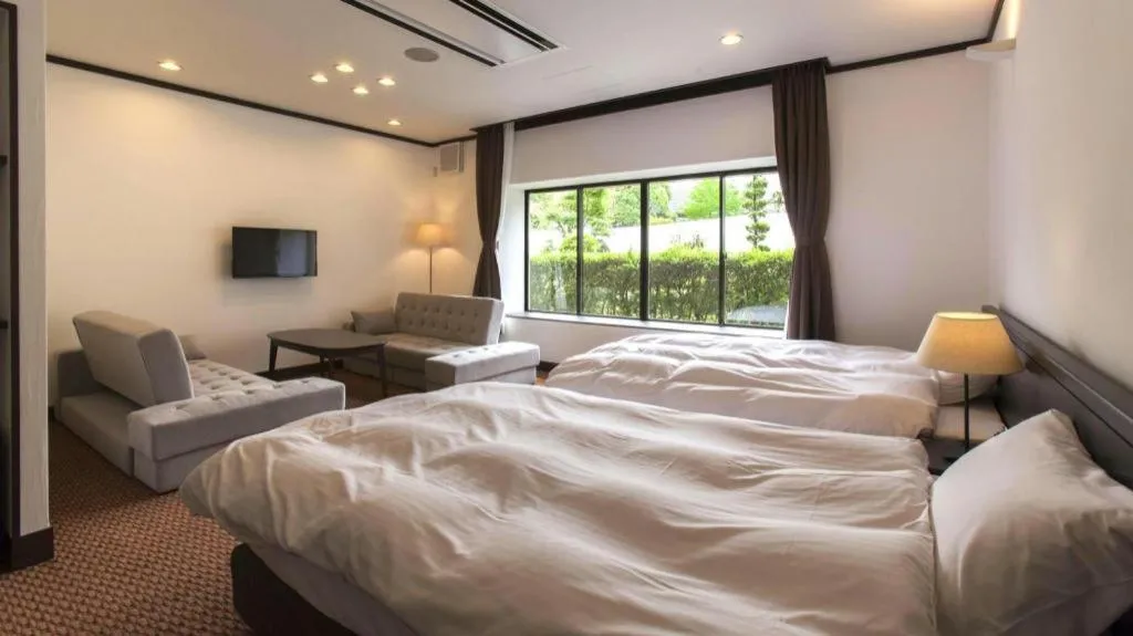 Bed in Hotel Silk Onsen Yamabiko