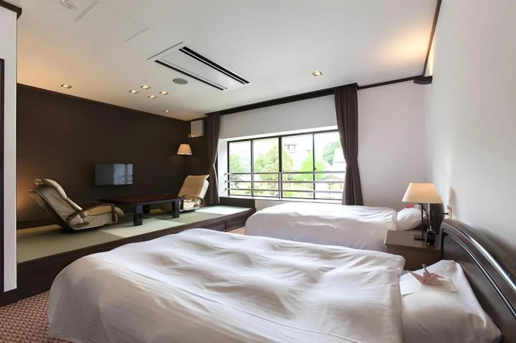 Bed in Hotel Silk Onsen Yamabiko