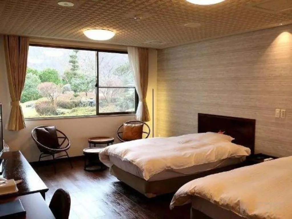 Bed in Hotel Silk Onsen Yamabiko