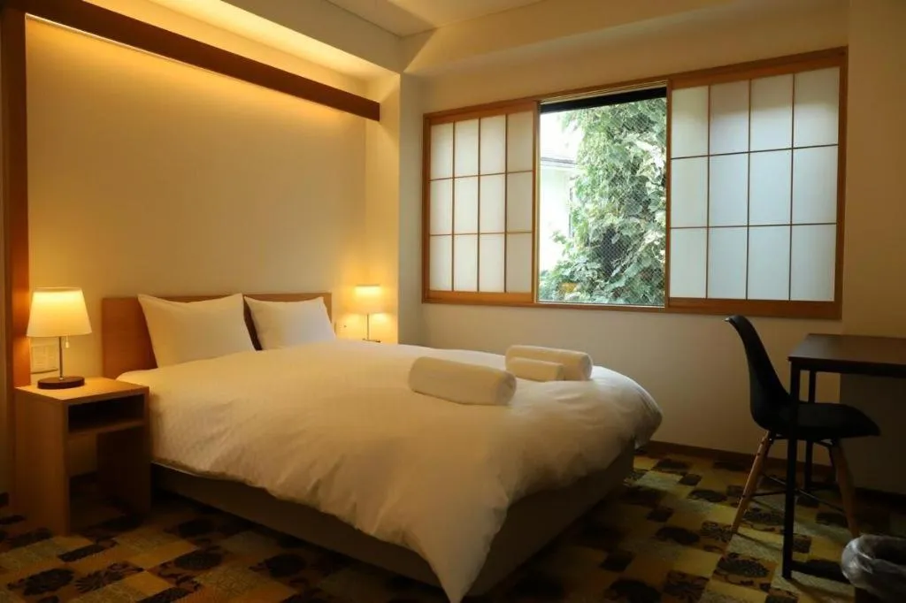 Bed in Kyoto Hatsune Hotel