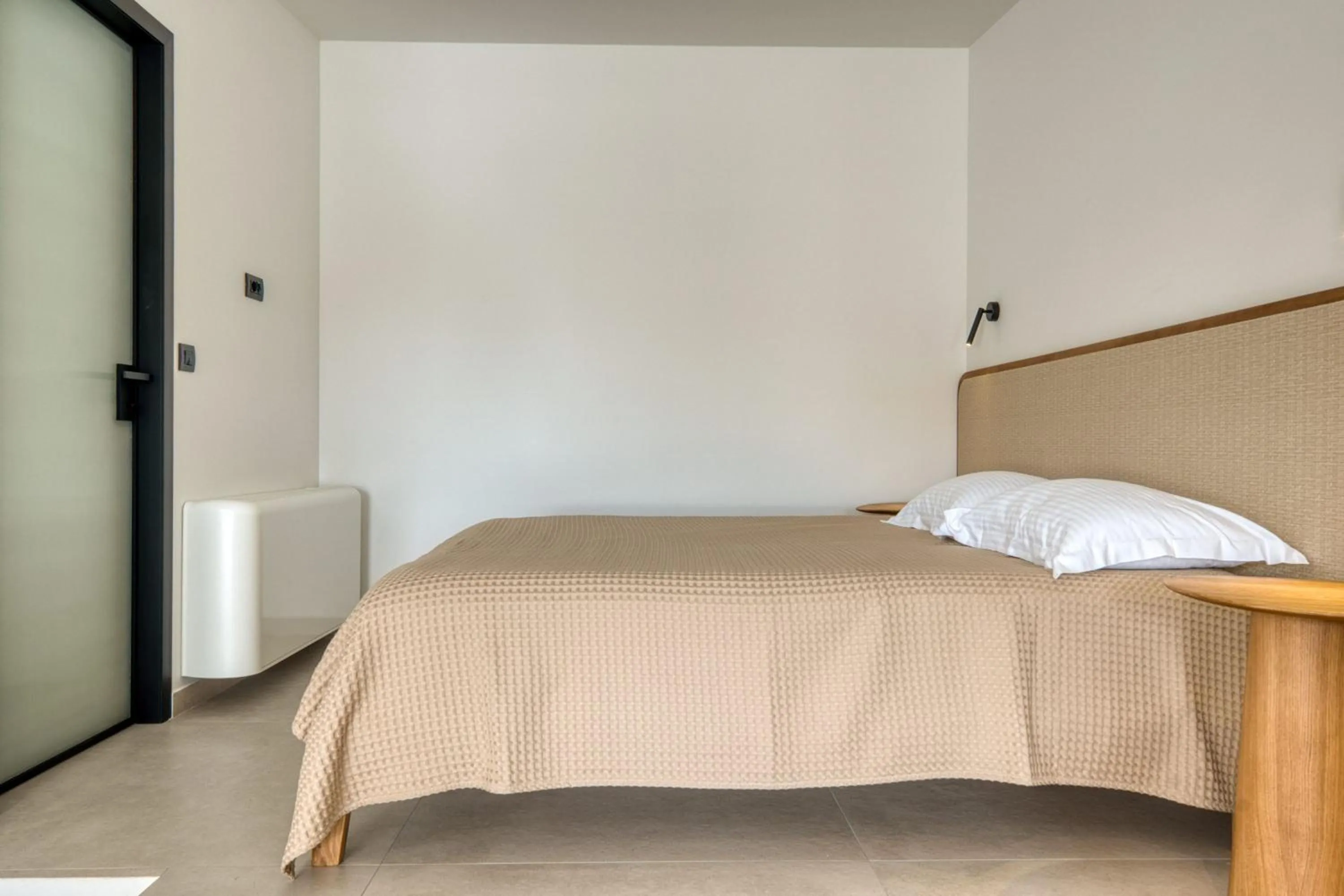 Bed in Anima Deluxe Suites