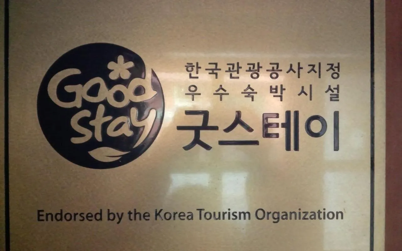 Property logo or sign in Hi Hotel