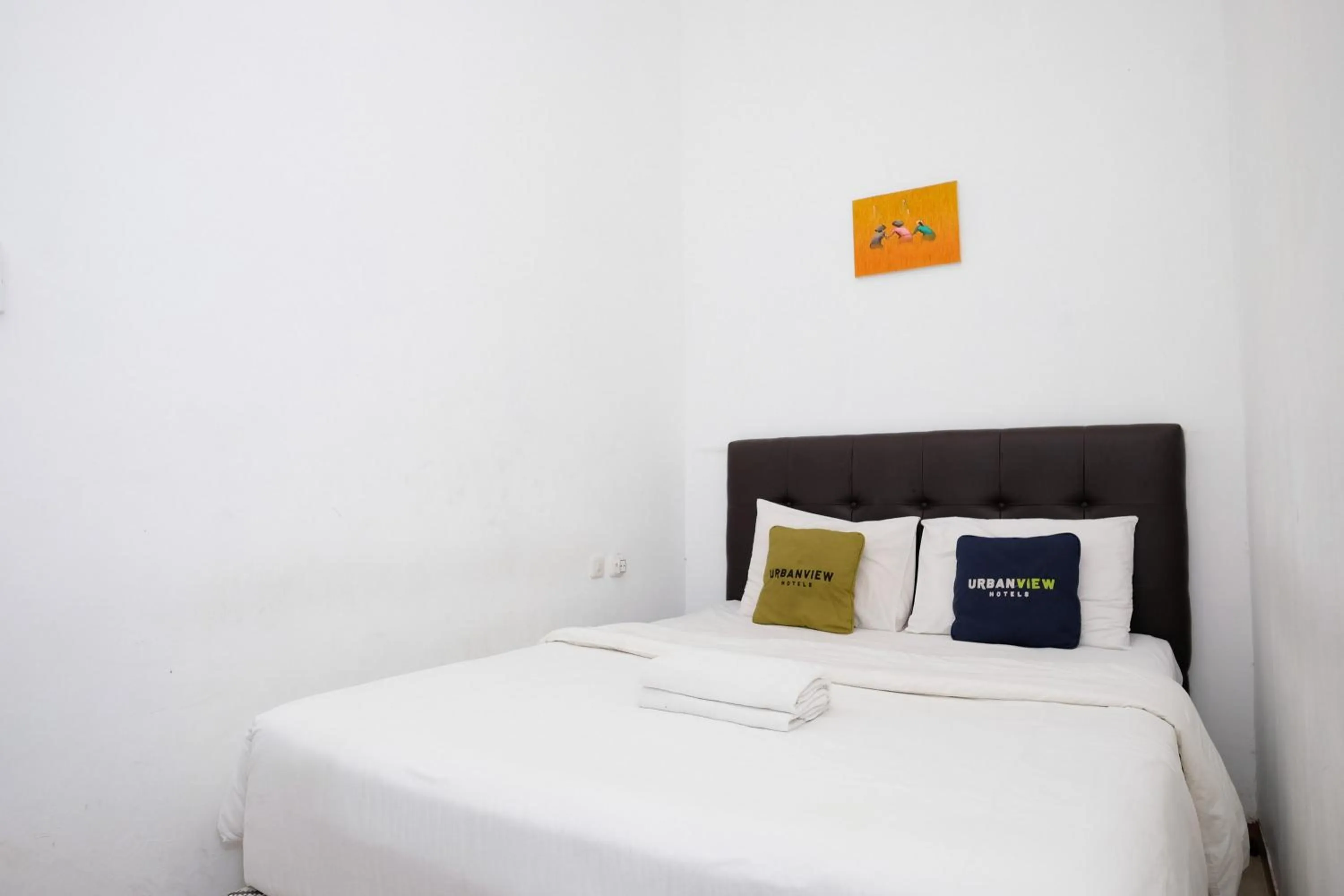 Bedroom, Bed in Urbanview Hotel Dommy Yogyakarta by RedDoorz