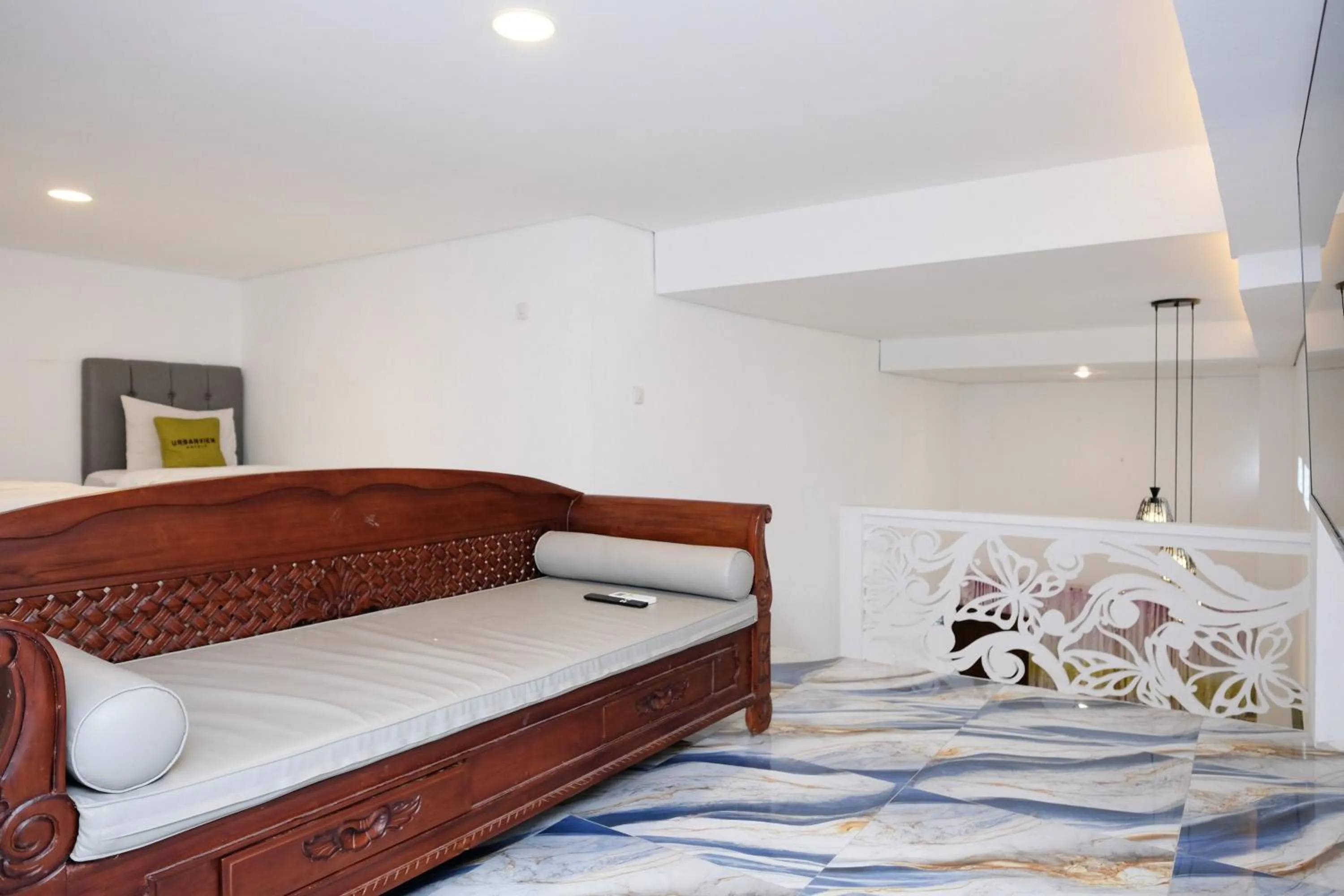 Seating area, Bed in Urbanview Hotel Dommy Yogyakarta by RedDoorz