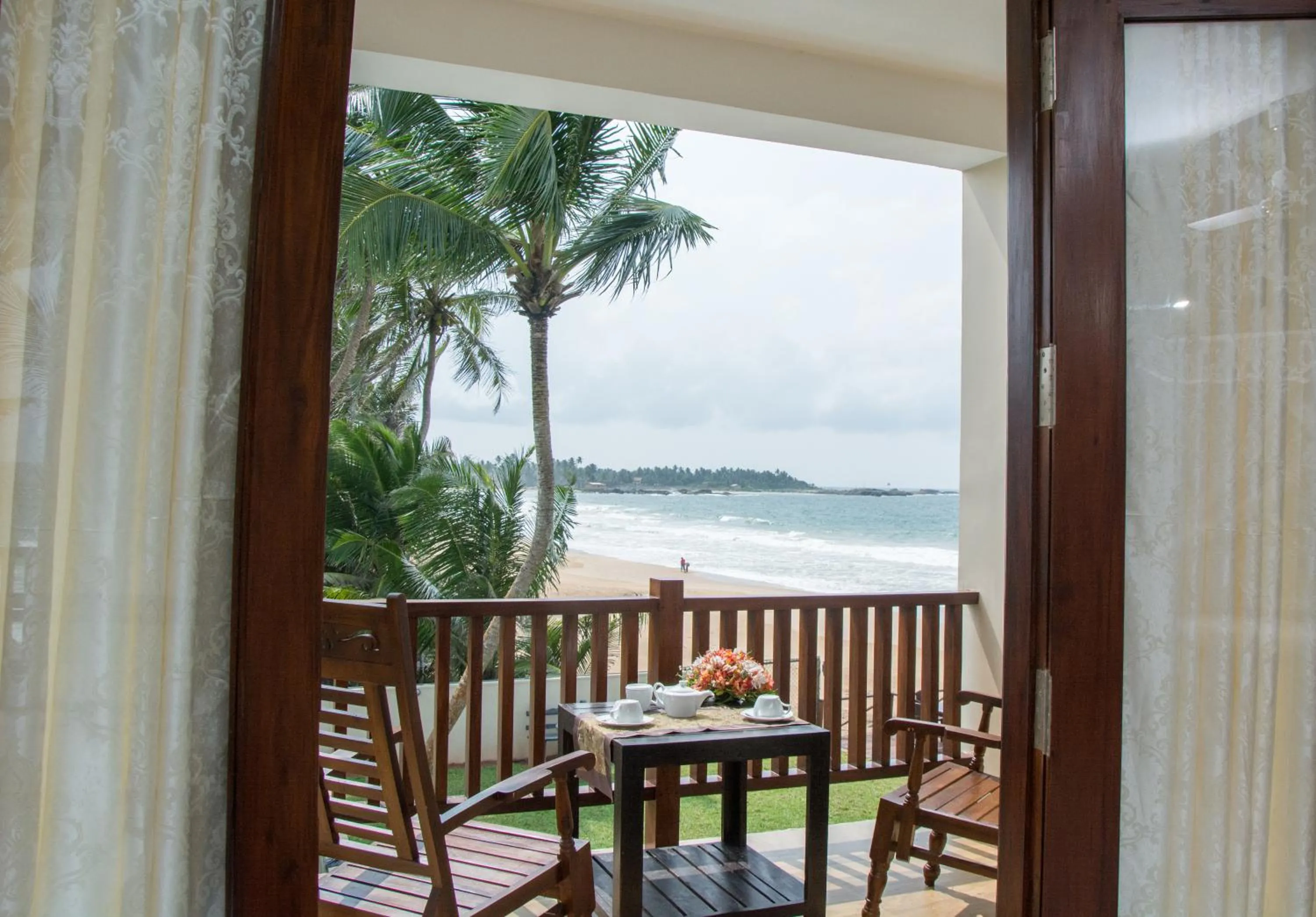 Deluxe Double Corner Sea View in Sapphire Seas Beachfront Hotel
