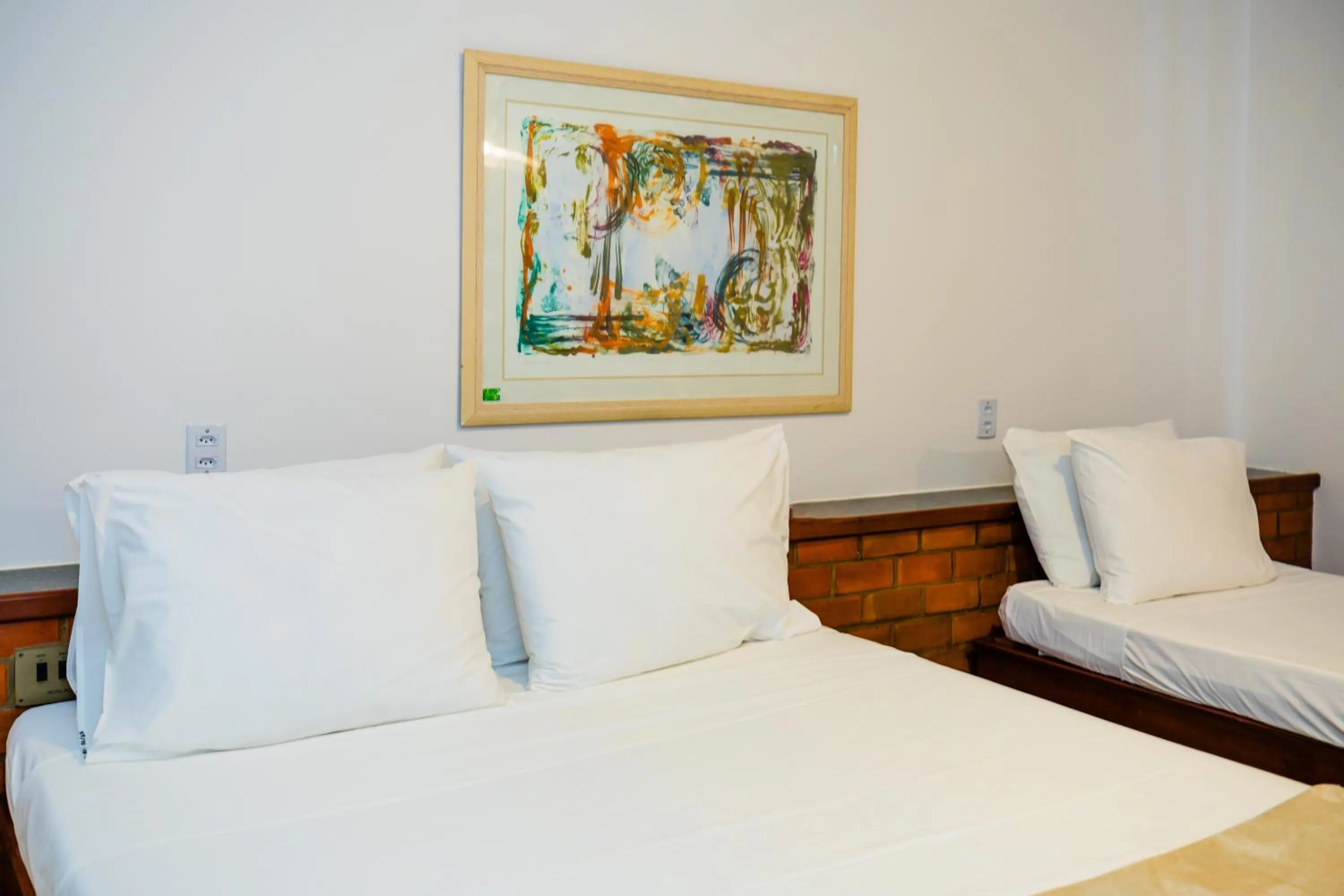 Bed in Mirai Beach Hotel