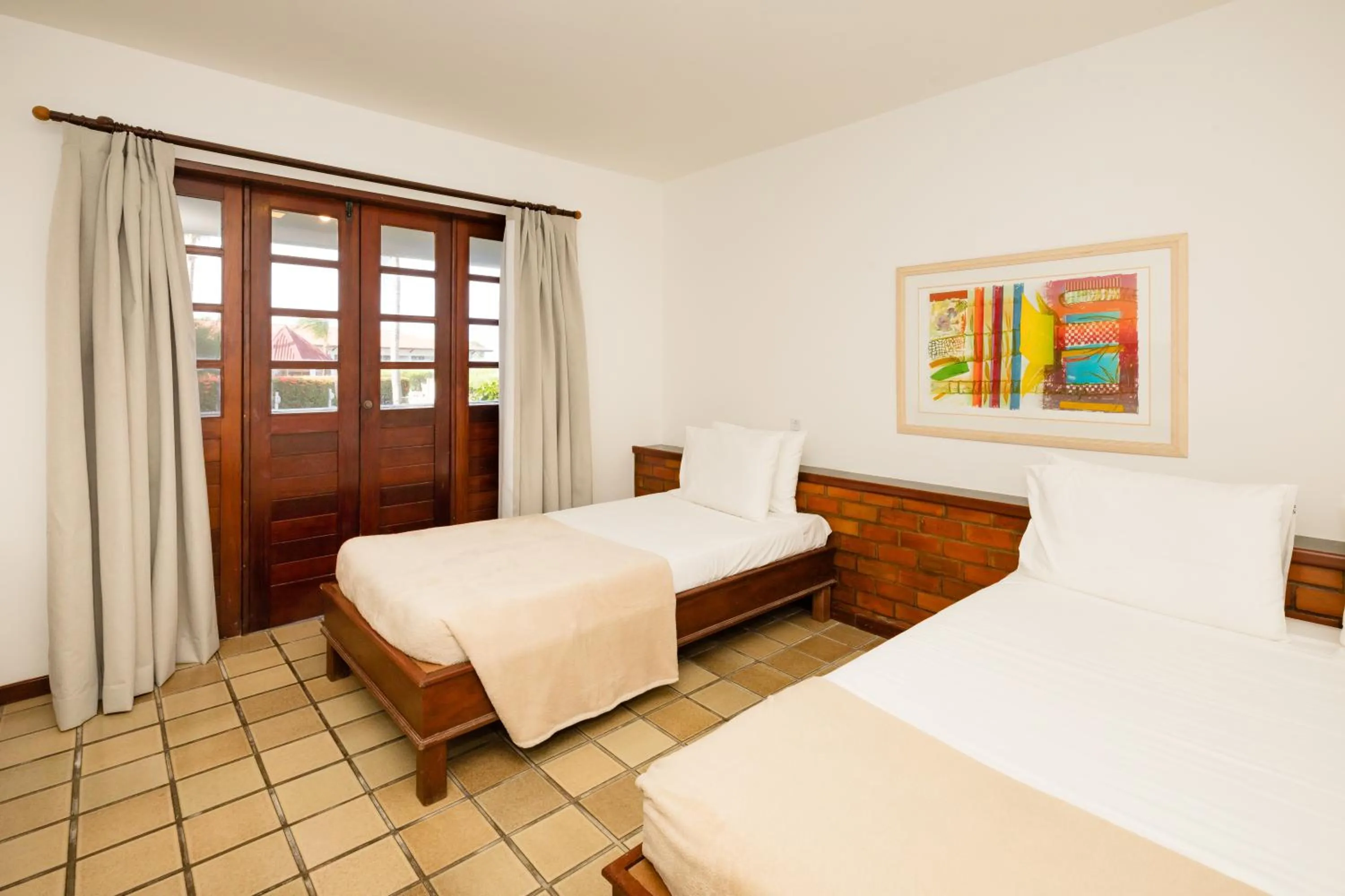 Bed in Mirai Beach Hotel