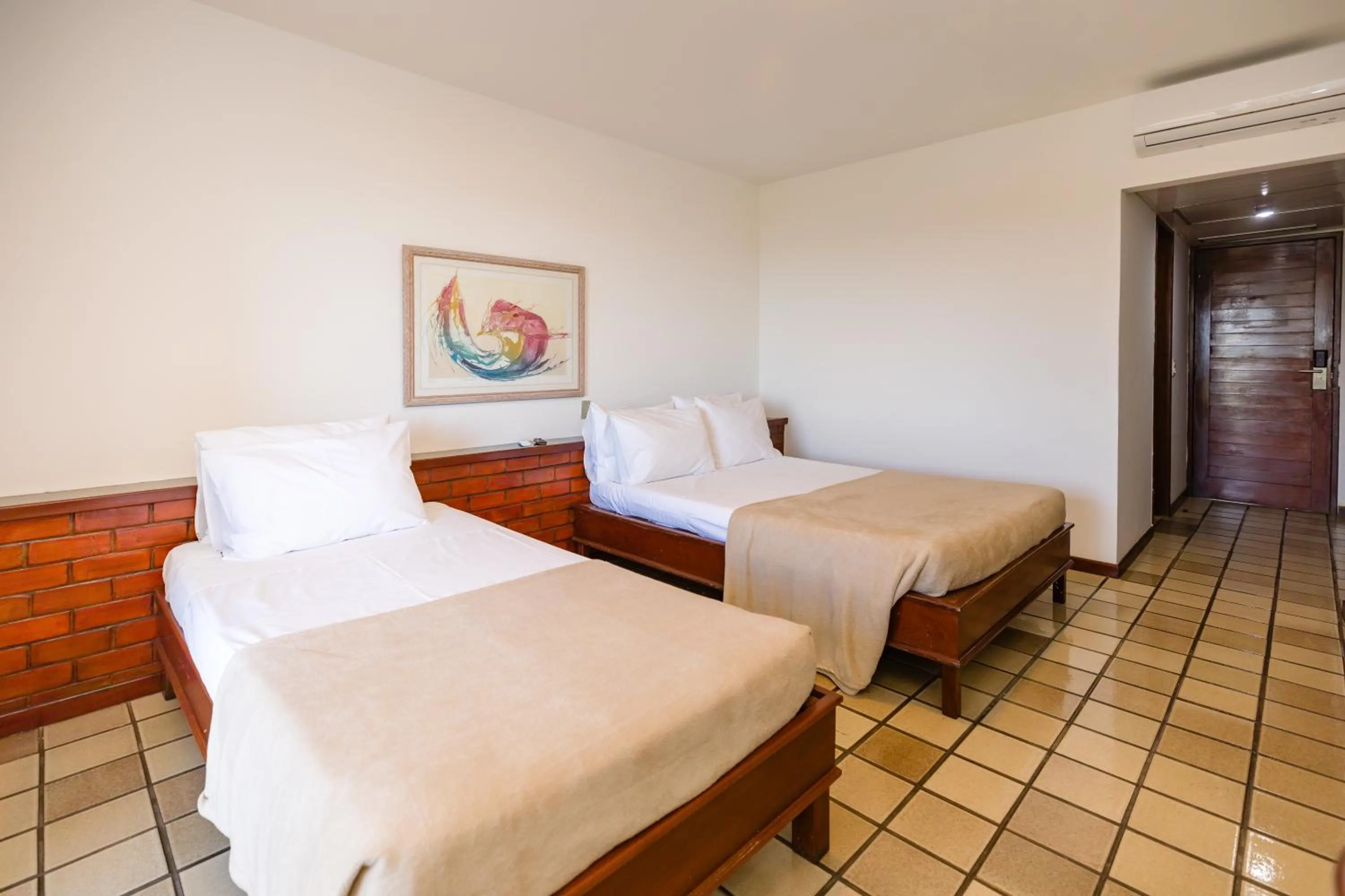 Bed in Mirai Beach Hotel