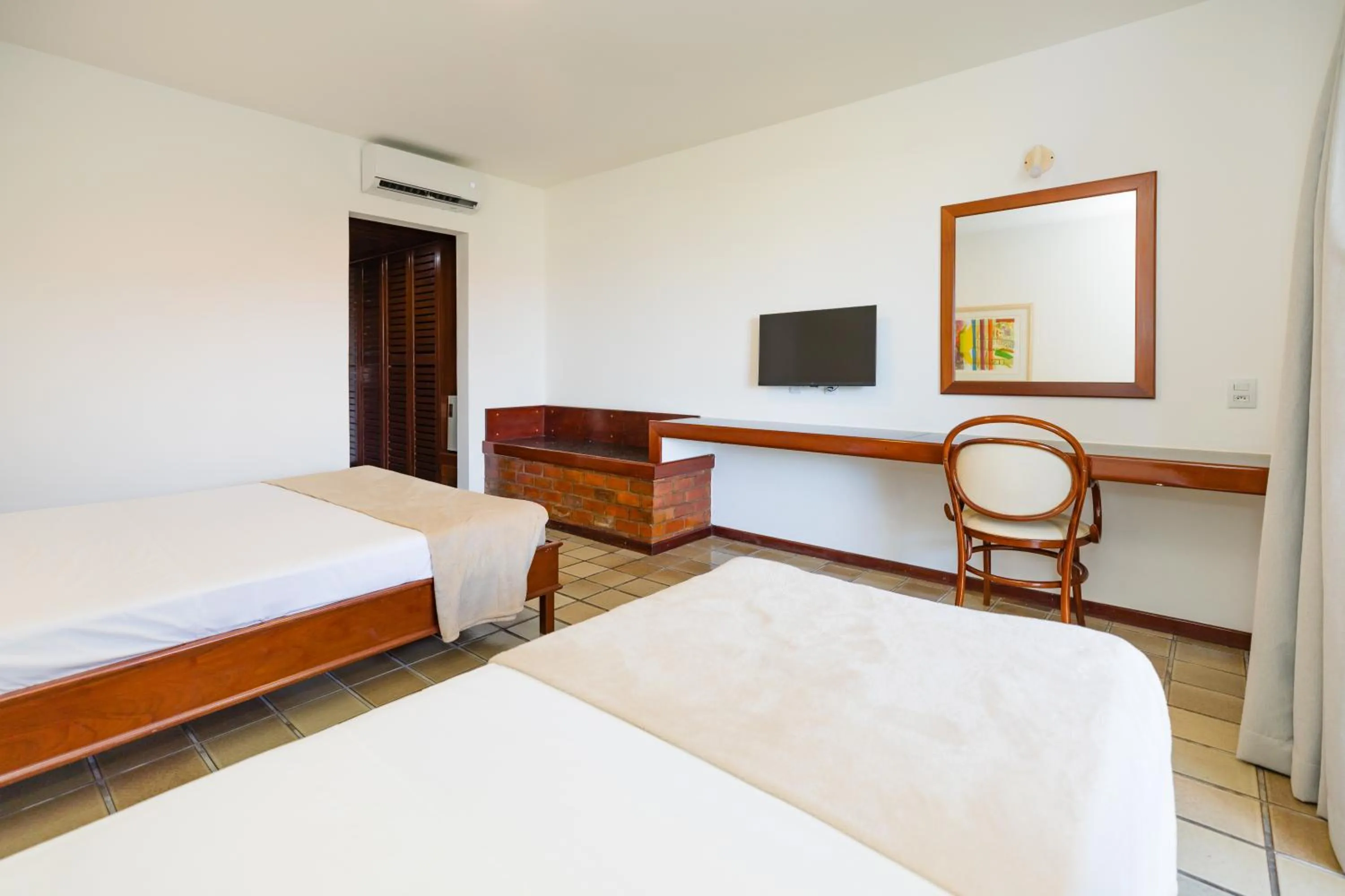 Bed in Mirai Beach Hotel