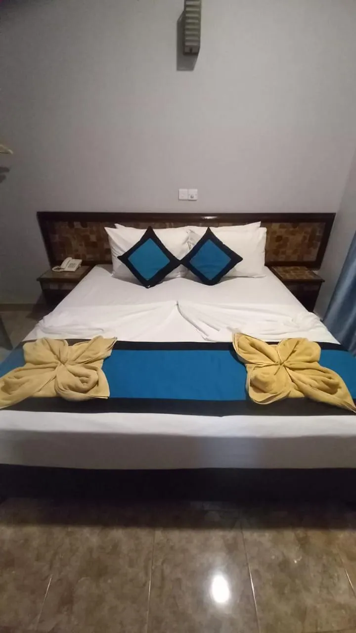 Bed in Blue Sand Beach Resort
