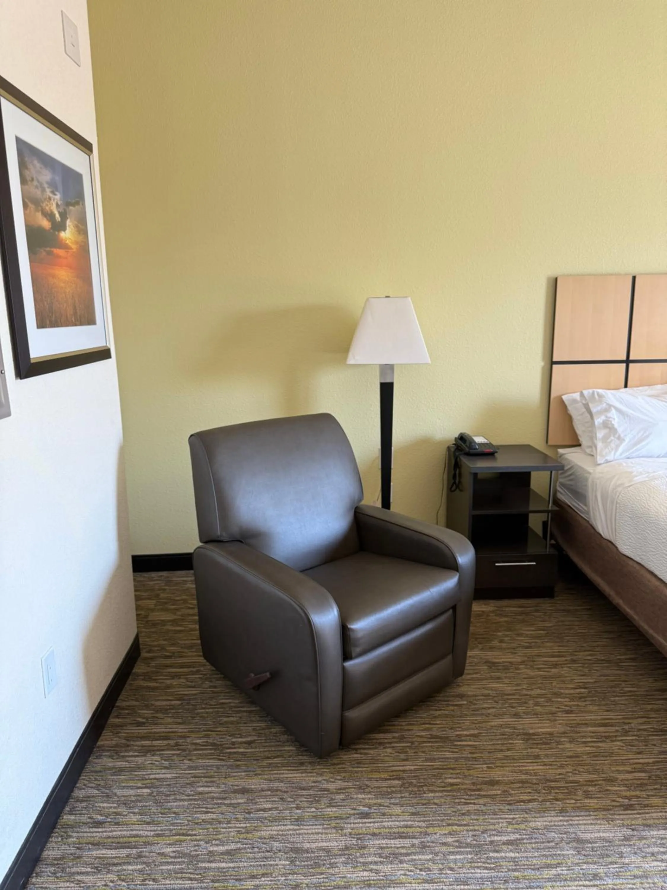 Seating area, Bed in Candlewood Suites Cotulla by IHG