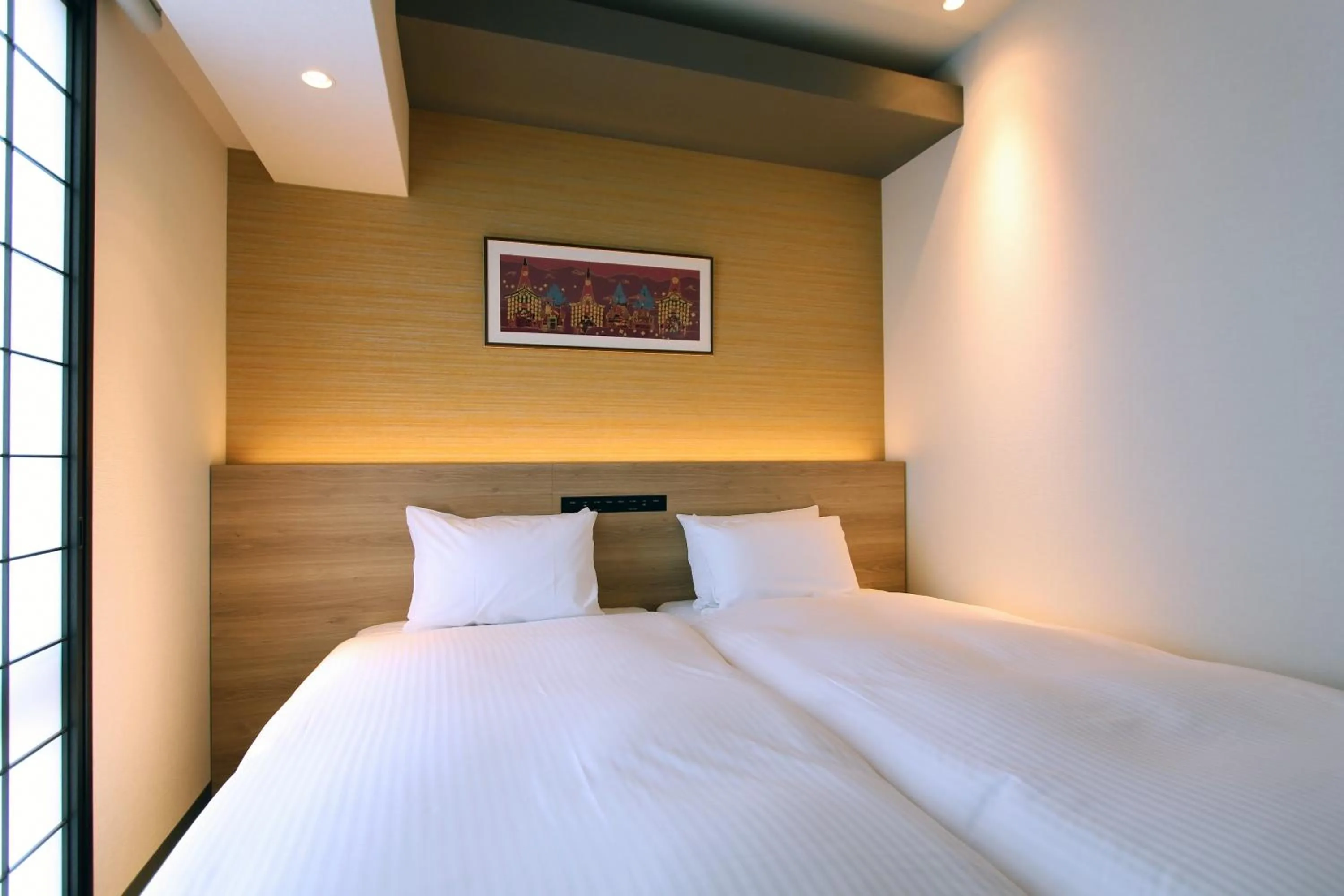 Bed in KOKO HOTEL Residence Kyoto Nijo Castle