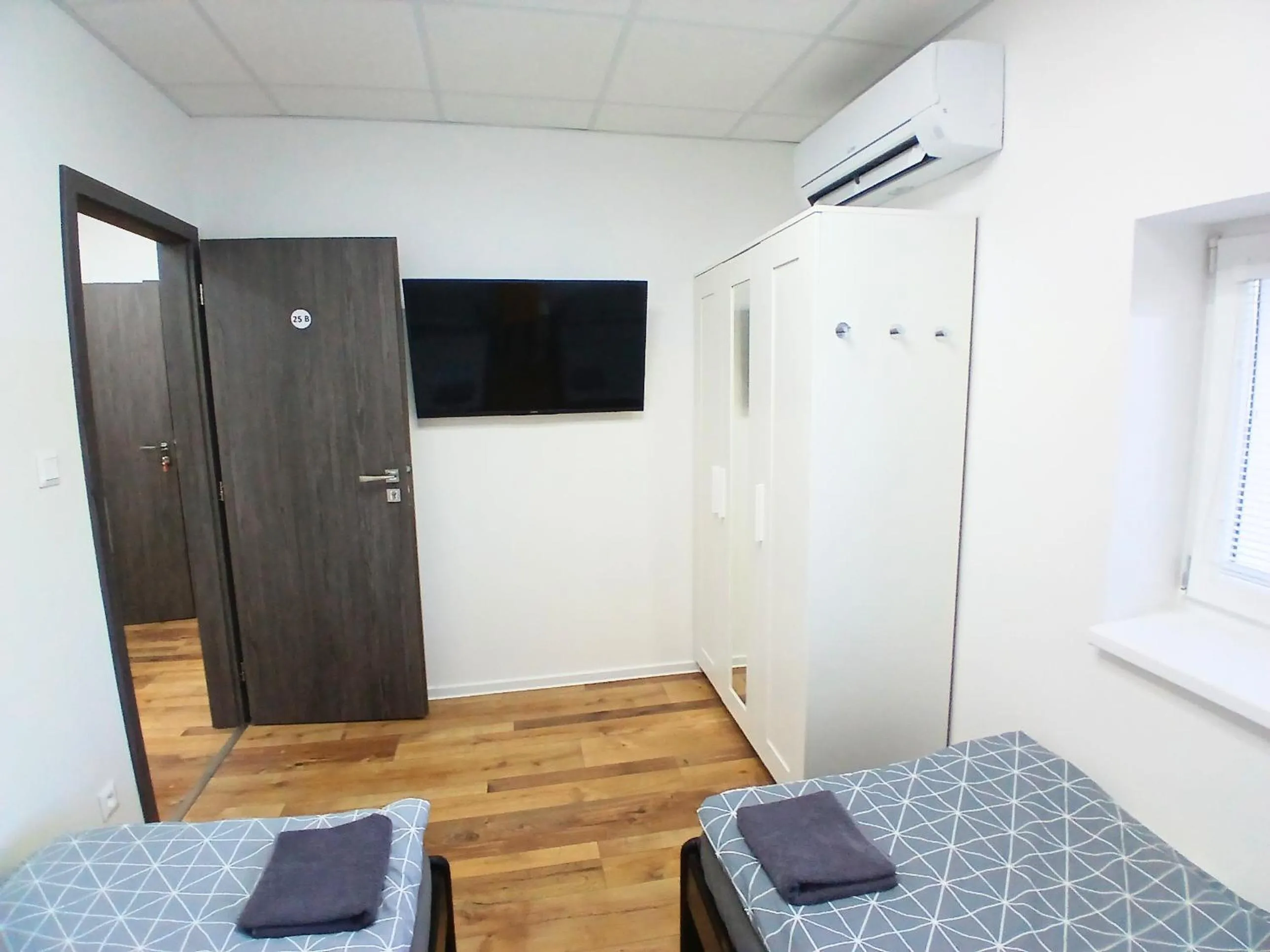 TV and multimedia, Bed in Dimael Hostel & Apartments