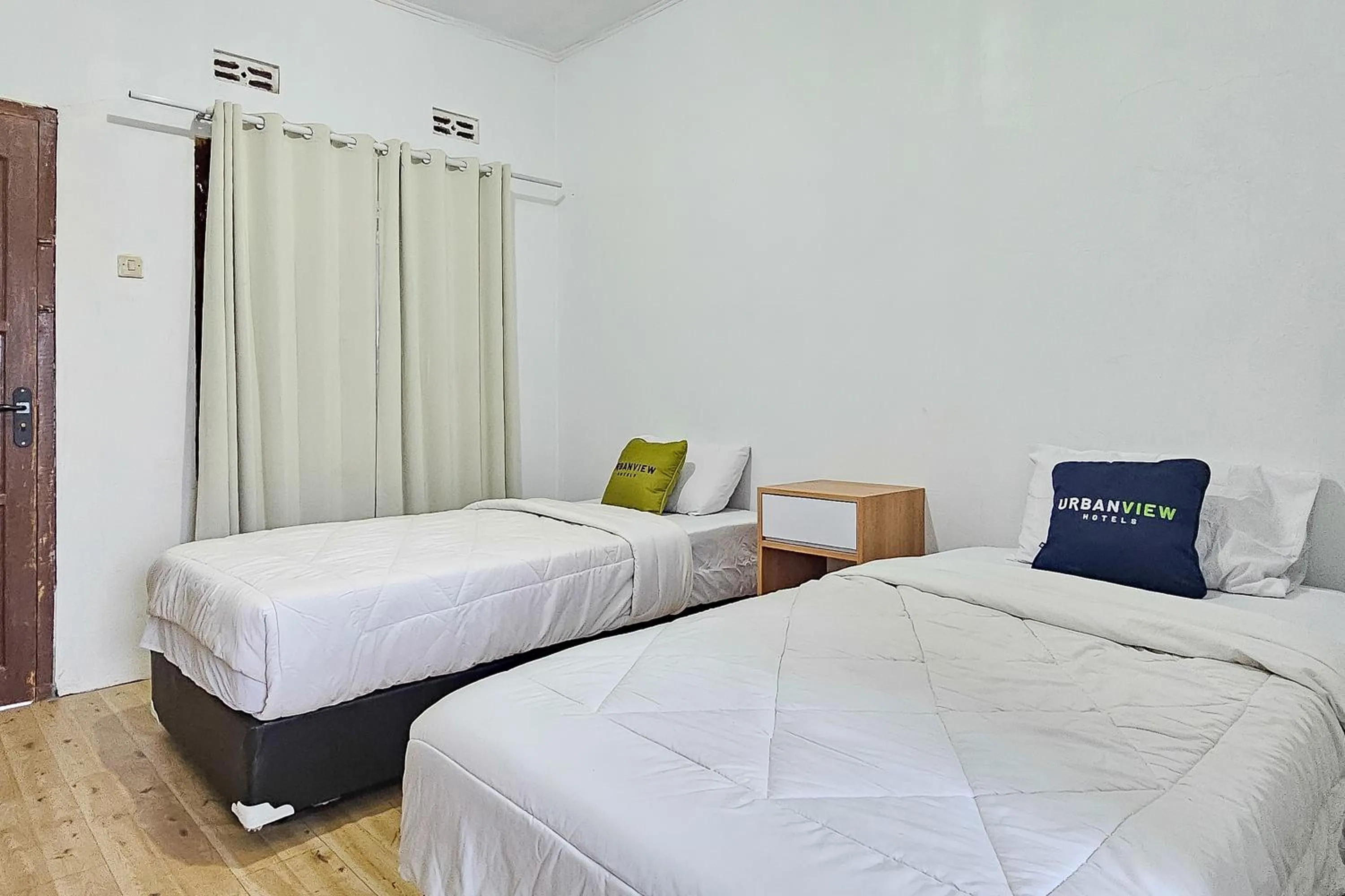 Bedroom, Bed in Urbanview Orchid Guest House