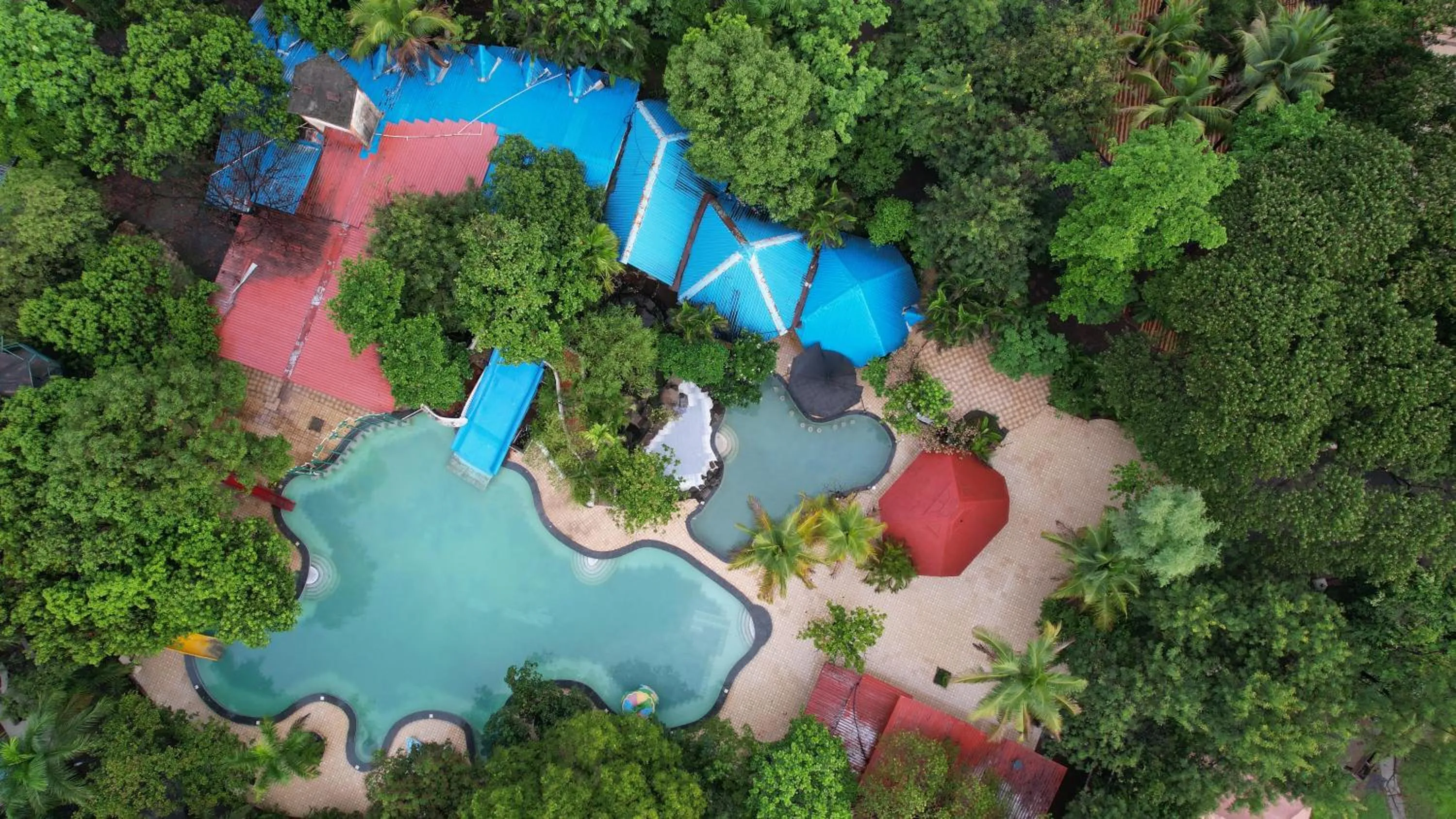 Swimming pool in Aayush Resort Karjat