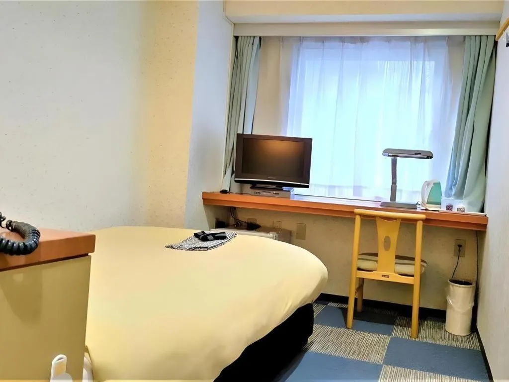 Bed in Ikebukuro Royal Hotel