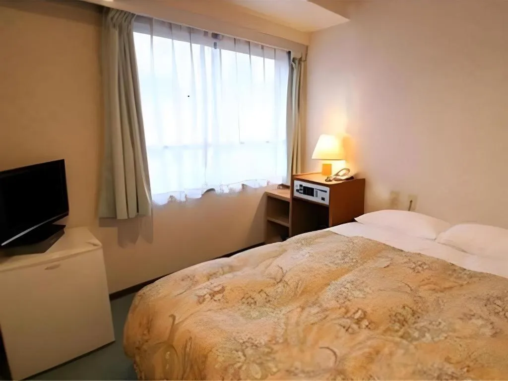 Bed in Ikebukuro Royal Hotel