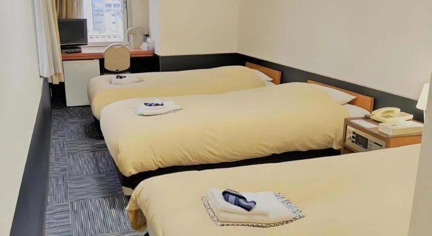 Bed in Ikebukuro Royal Hotel