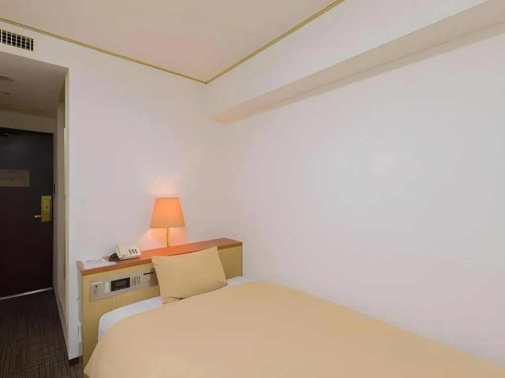 Bed in Ikebukuro Royal Hotel