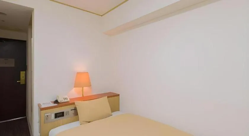 Bed in Ikebukuro Royal Hotel