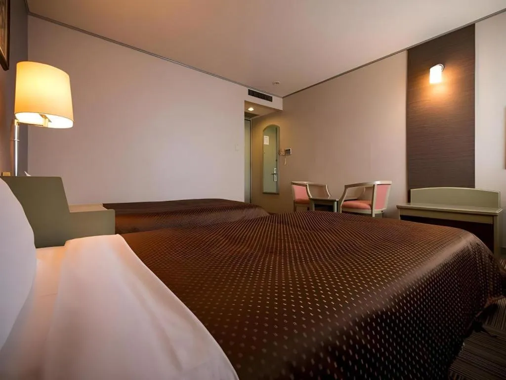 Bed in New Biwako Hotel