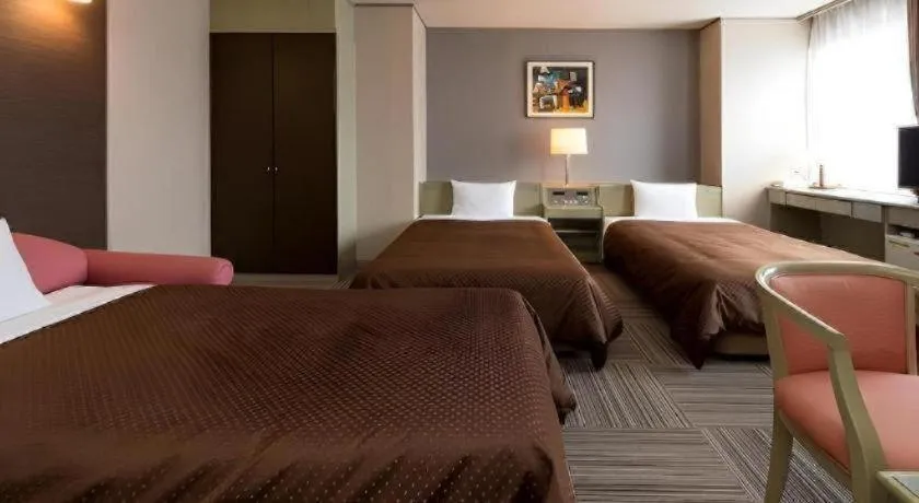 Bed in New Biwako Hotel