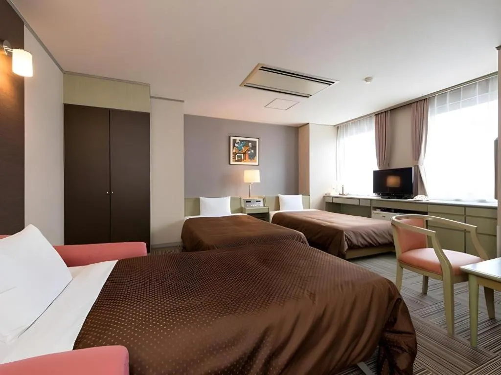 Bed in New Biwako Hotel