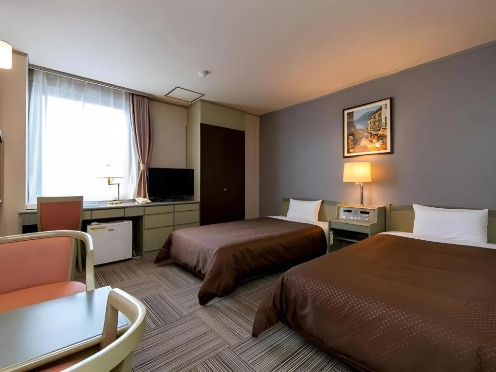 Bed in New Biwako Hotel