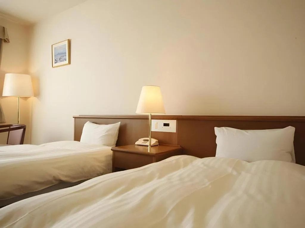 Bed in Kamisuwa Station Hotel