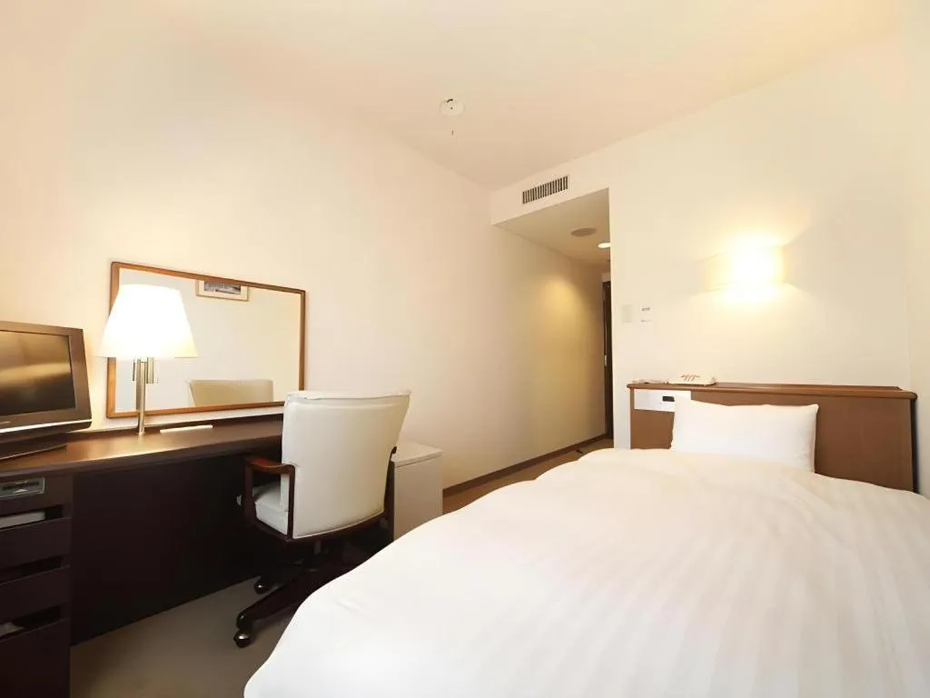 Bed in Kamisuwa Station Hotel