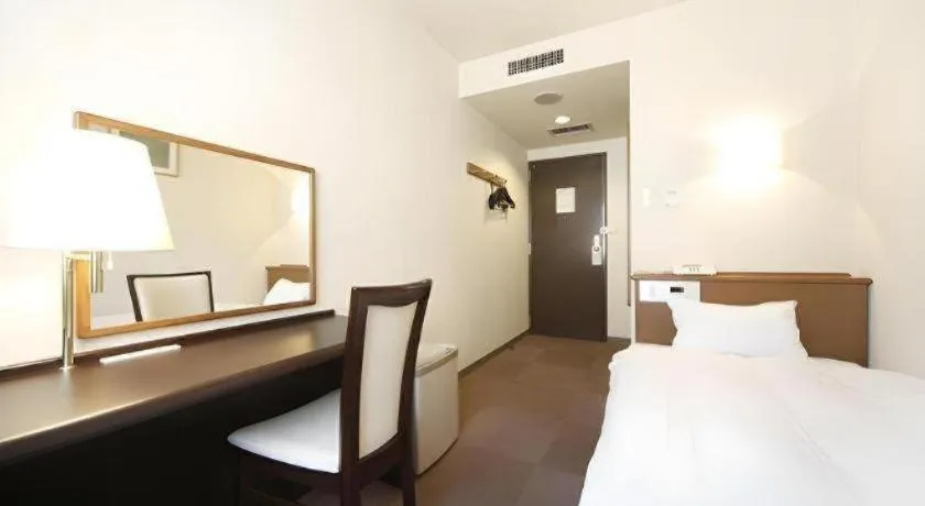 Bed in Kamisuwa Station Hotel