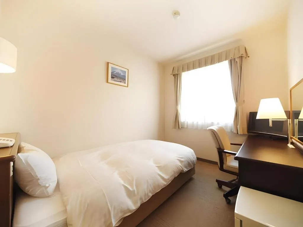 Bed in Kamisuwa Station Hotel