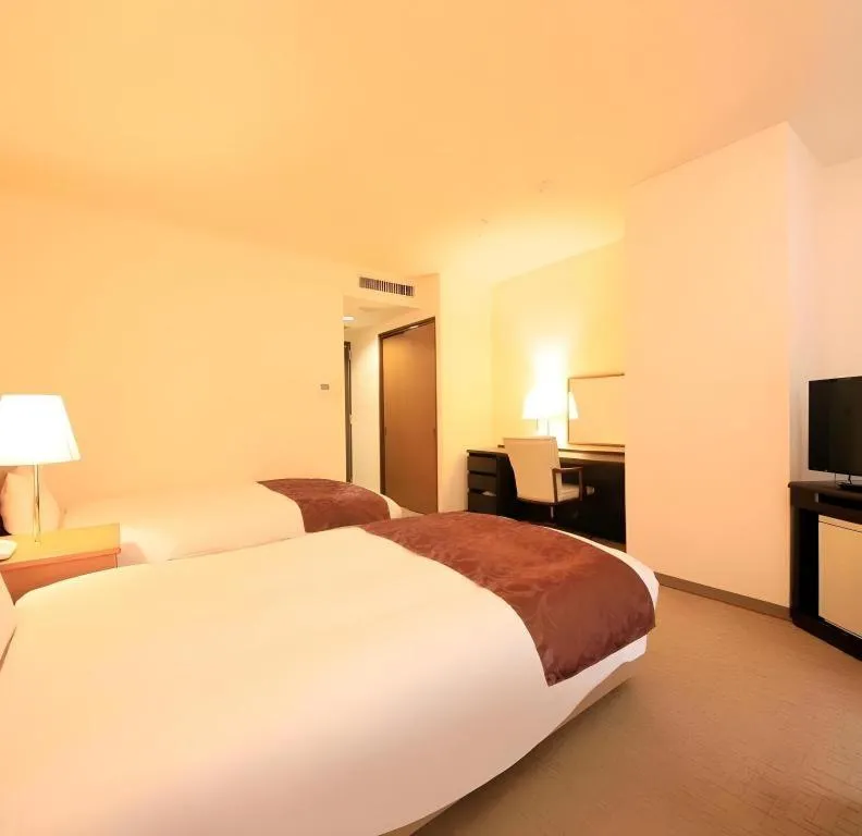 Bed in Kamisuwa Station Hotel