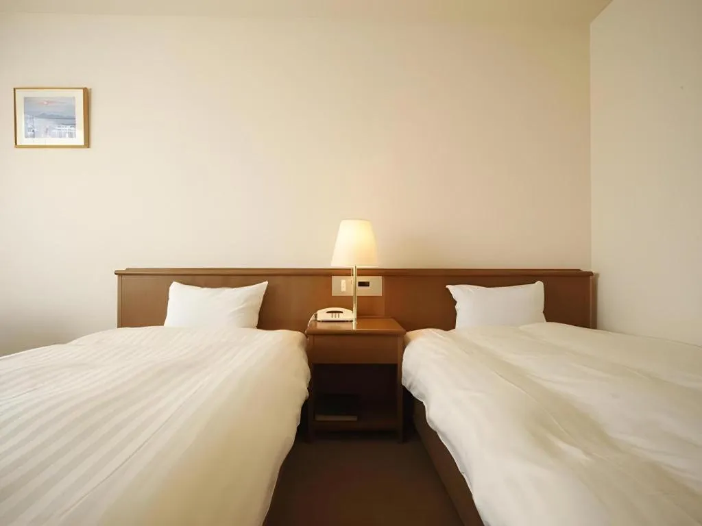 Bed in Kamisuwa Station Hotel