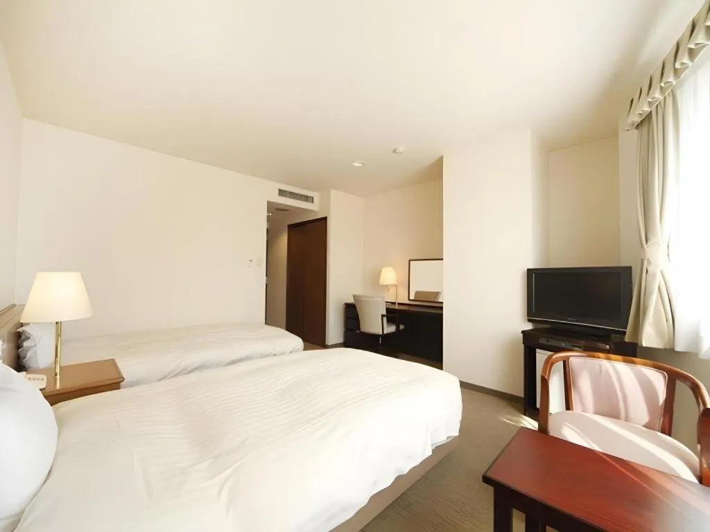 Bed in Kamisuwa Station Hotel