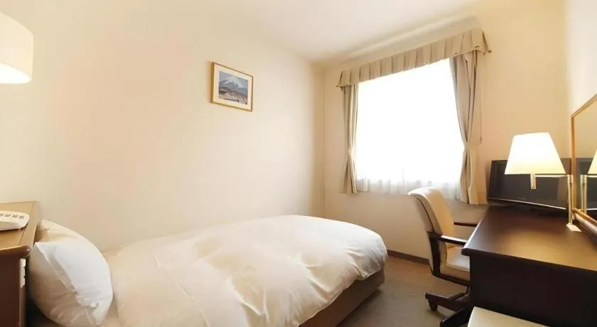 Bed in Kamisuwa Station Hotel