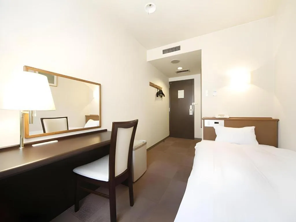 Bed in Kamisuwa Station Hotel