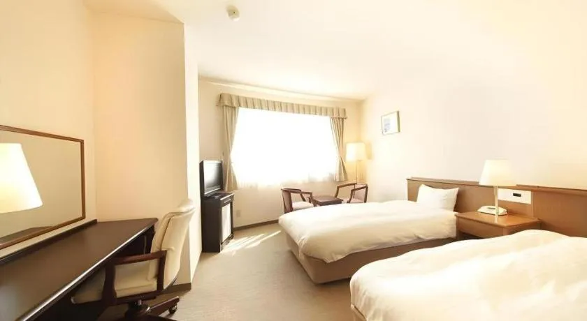 Bed in Kamisuwa Station Hotel