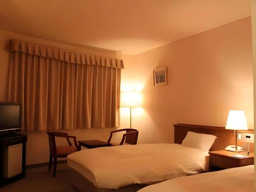 Bed in Kamisuwa Station Hotel