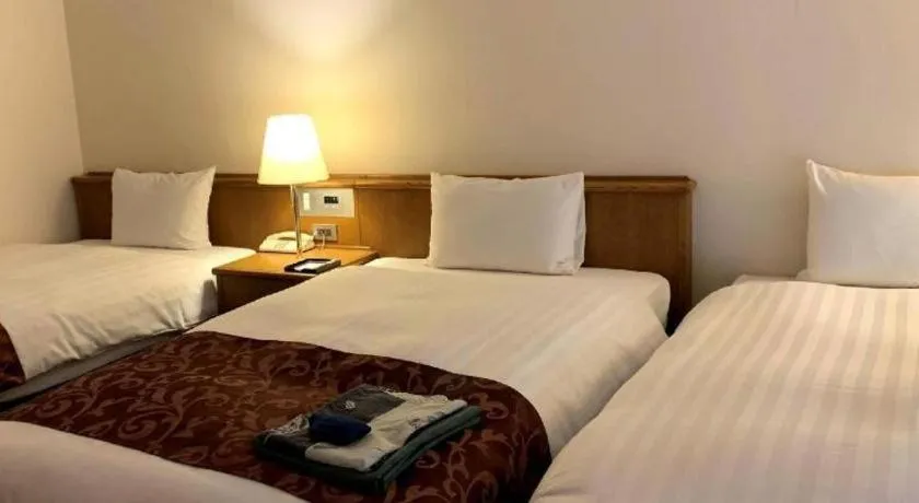 Bed in Kamisuwa Station Hotel