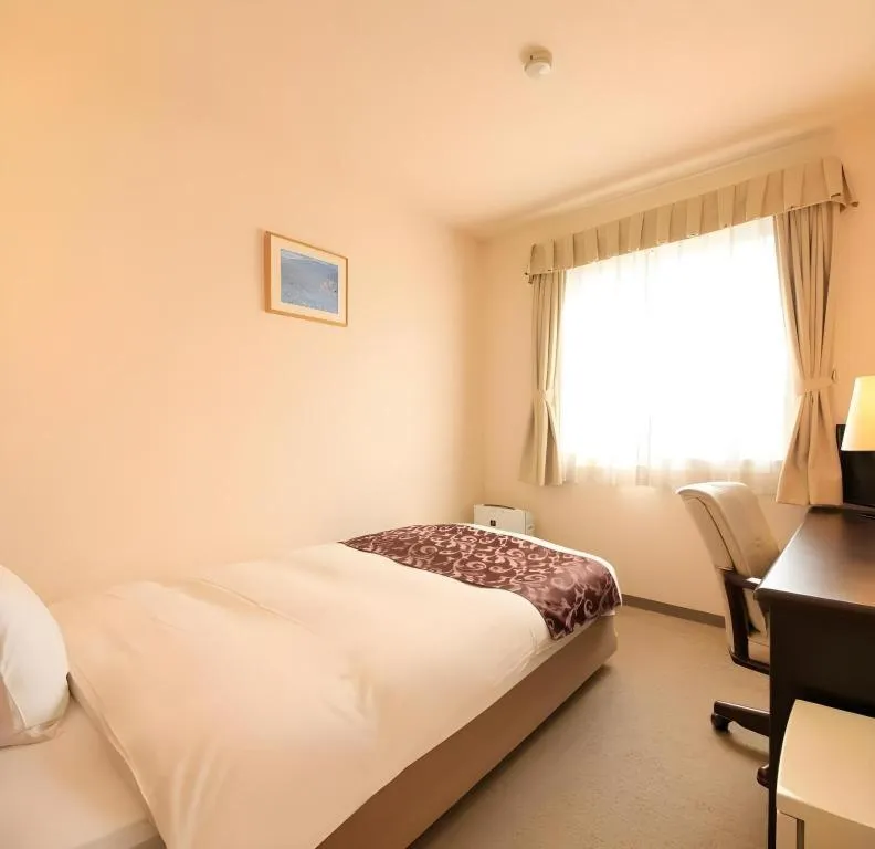 Bed in Kamisuwa Station Hotel