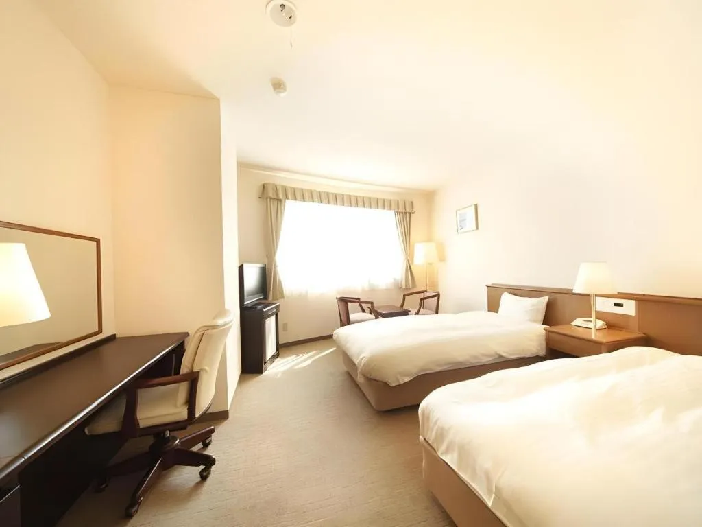 Bed in Kamisuwa Station Hotel