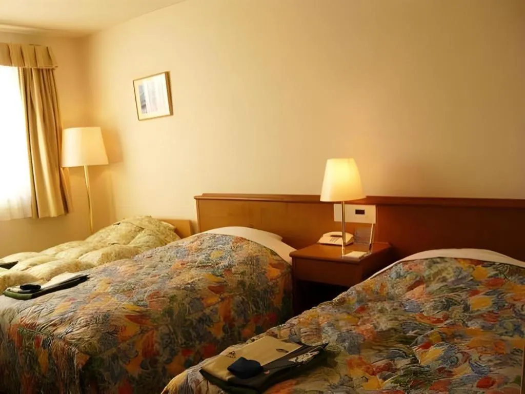 Bed in Kamisuwa Station Hotel