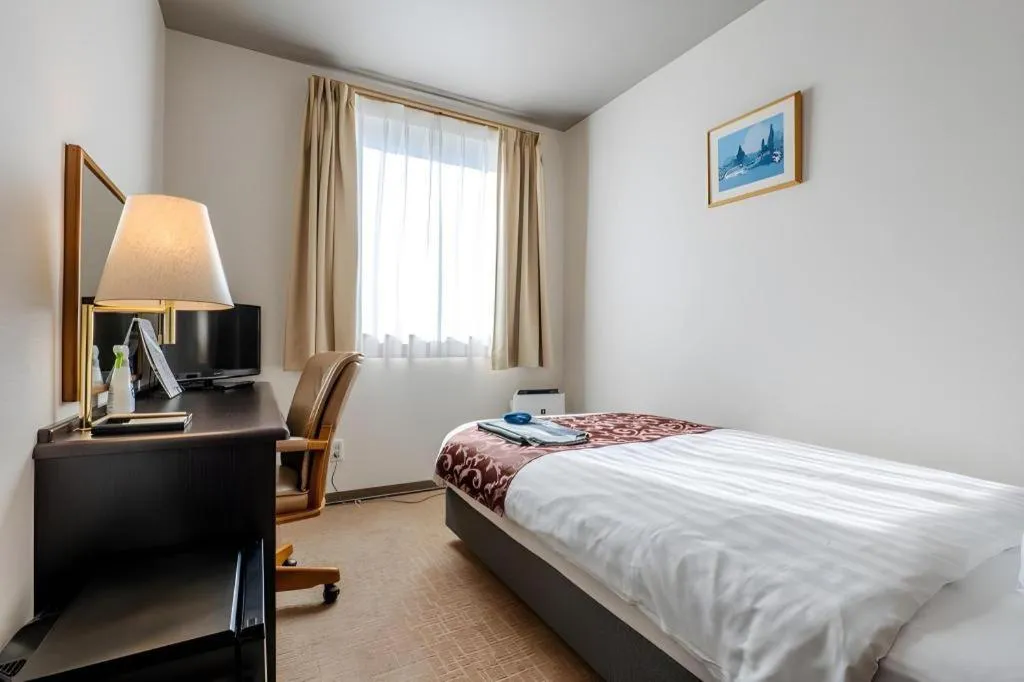 Bed in Kamisuwa Station Hotel