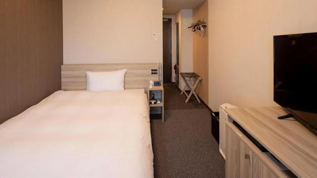 Bed in Hotel Route Inn Miyakonojo