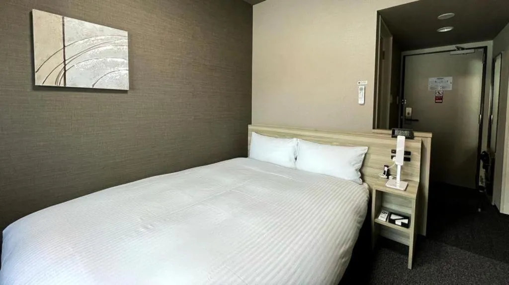 Bed in Hotel Route Inn Miyakonojo