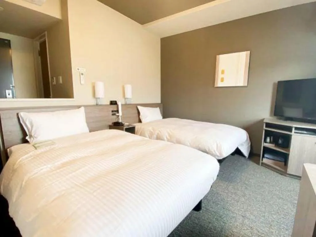 Bed in Hotel Route Inn Miyakonojo